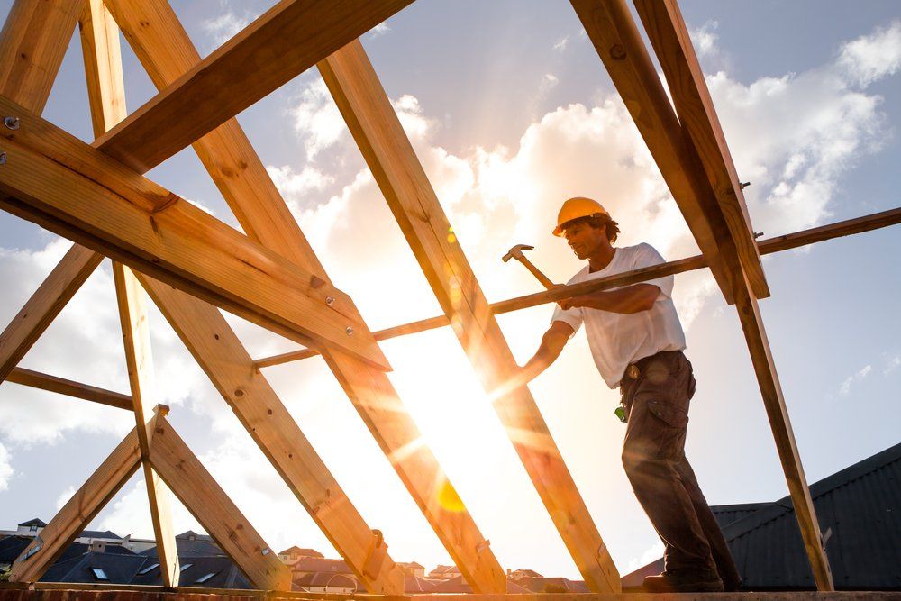 Carpenter Working On Roof Structure — Territory Timber and Hardware in Katherine, NT