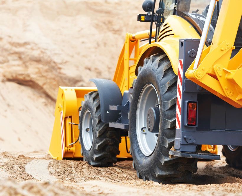 Wheel Loader Excavator With Backhoe Unloading Sand At Eathmoving Works — Bearfast Bearquip In Taminda NSW