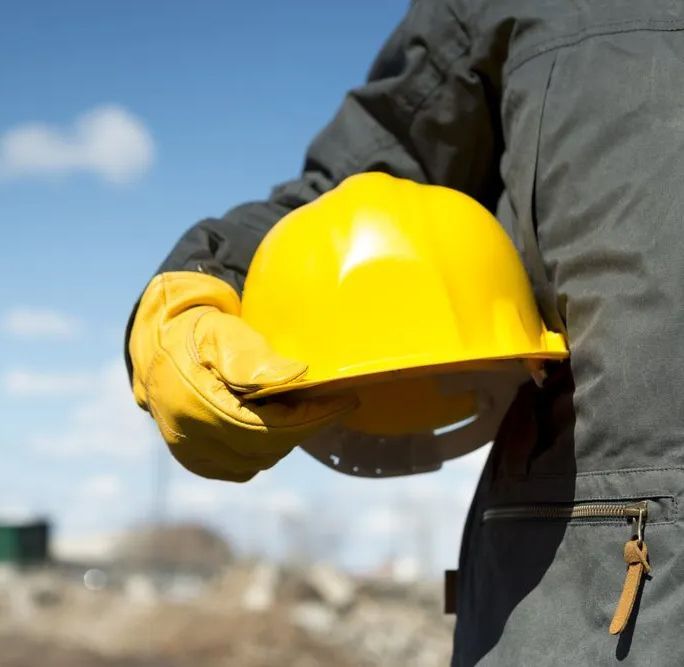 Builder With Yellow Hardhat And Gloves — Bearfast Bearquip In Taminda NSW
