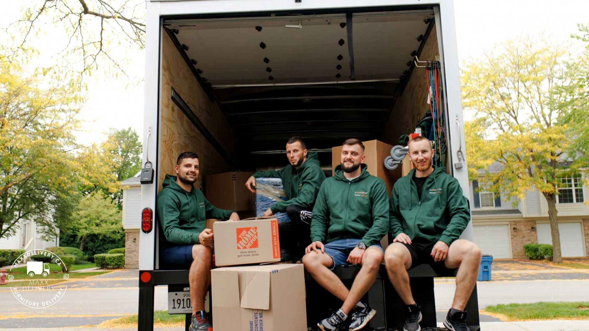 Movers inside a 24 Ft Moving Truck  after a full-service move - interior design deliveries