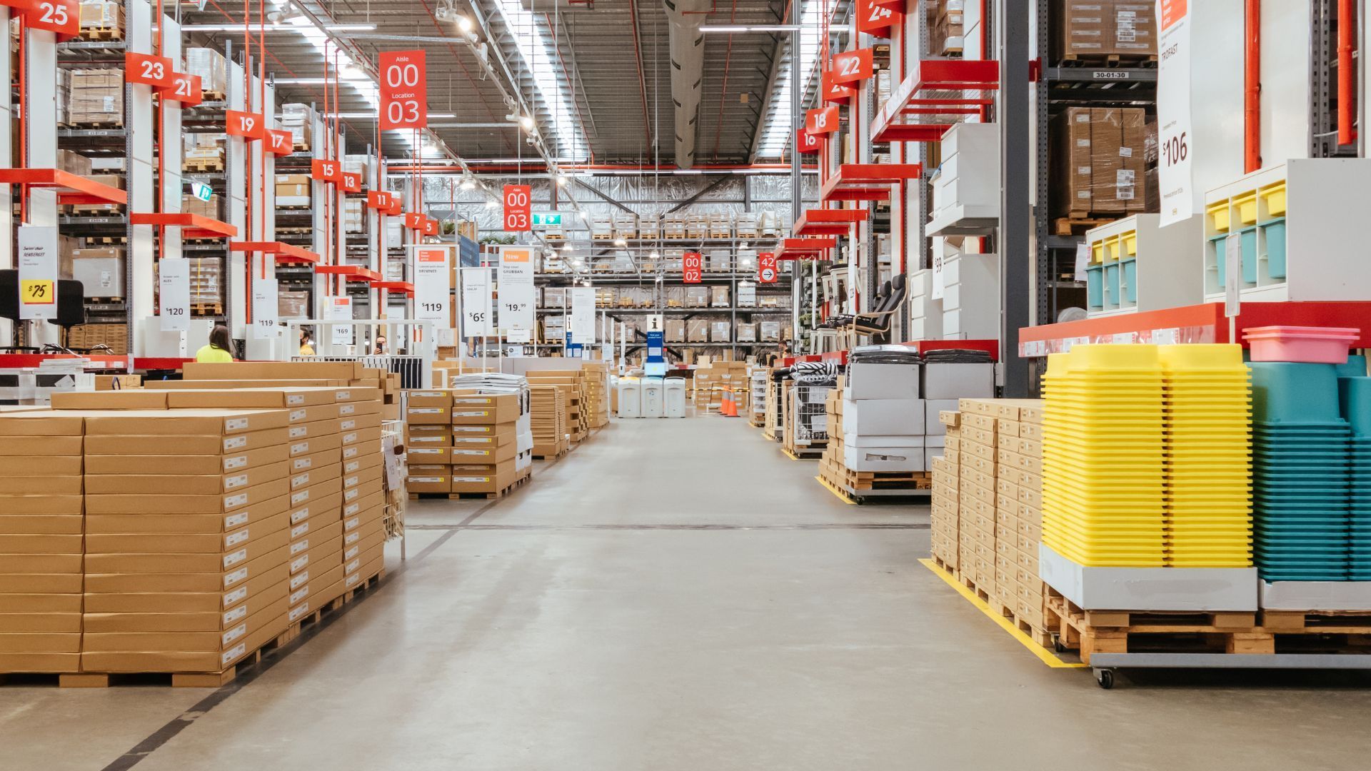 A large warehouse filled with lots of boxes and containers