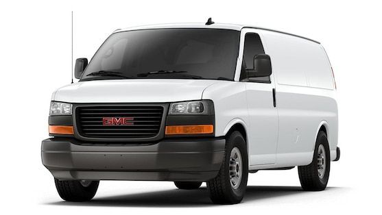 A white gmc van is parked on a white background.