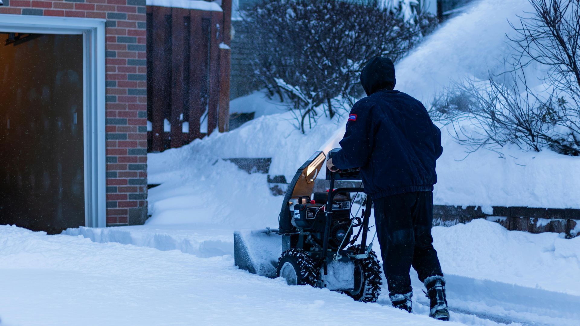 Family organizing home and clearing snow before moving day