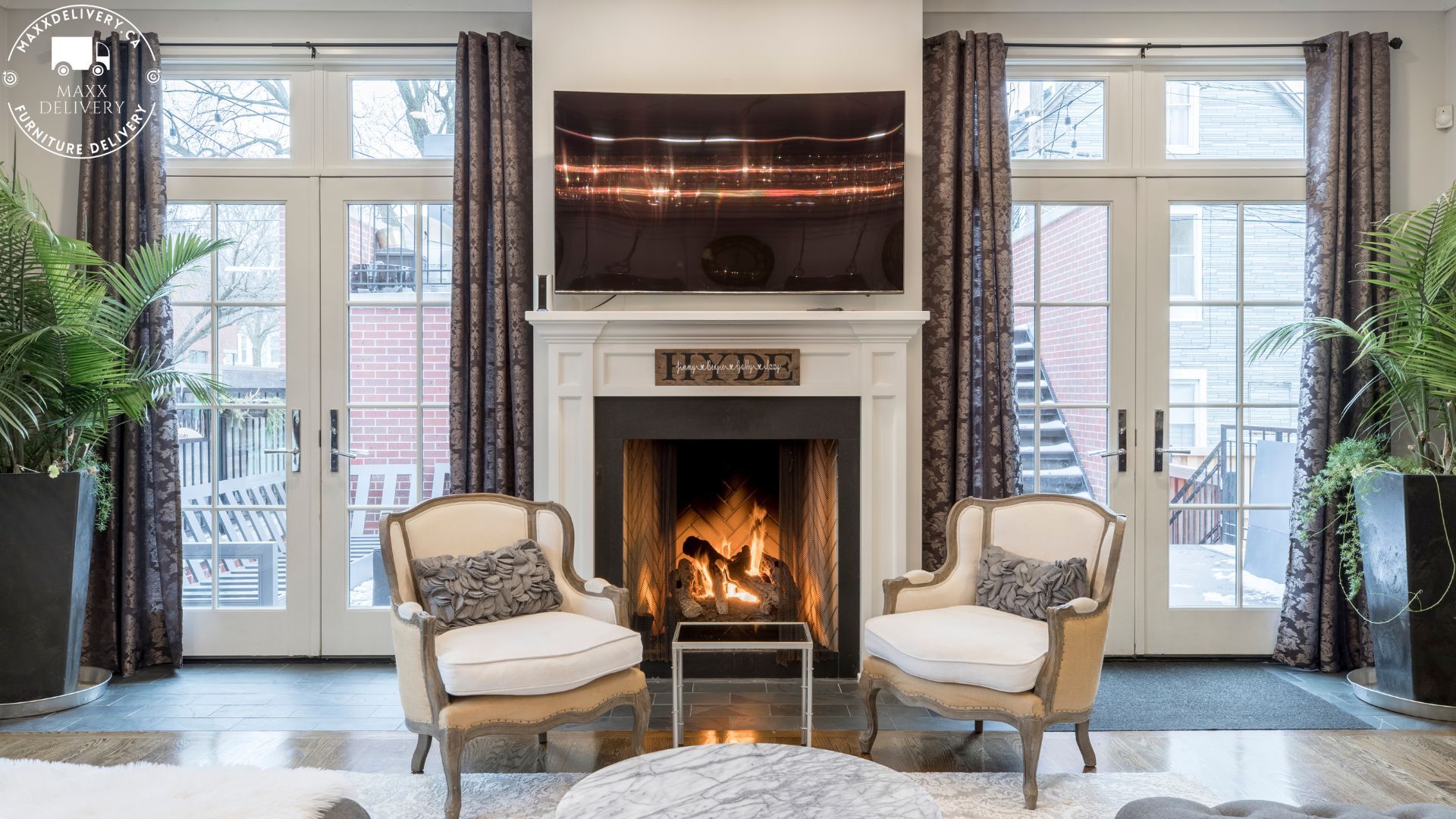 Bright living room with French chairs and a fireplace - furniture delivery Toronto