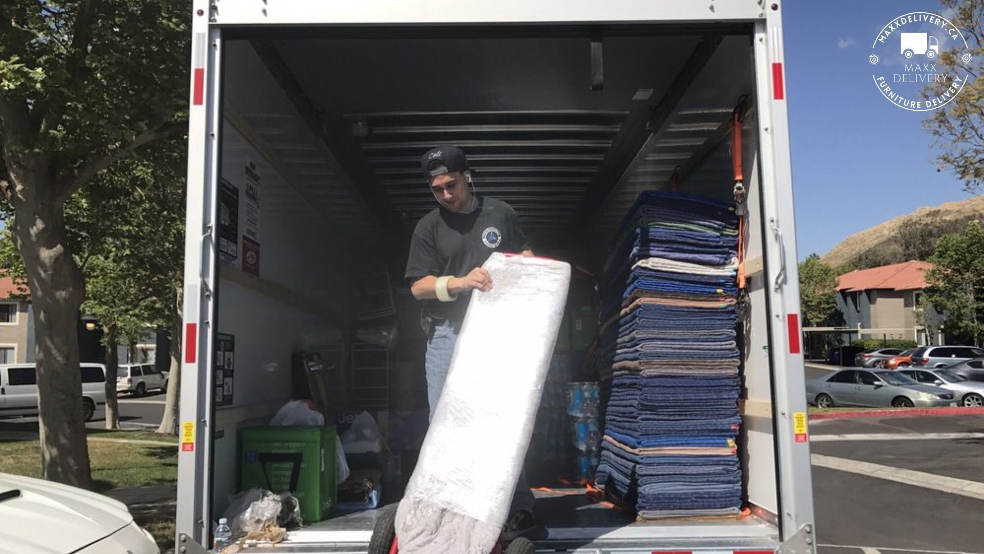 Mover inside a Maxxdelivery 15 Ft  Moving Truck - Full service Move in Toronto