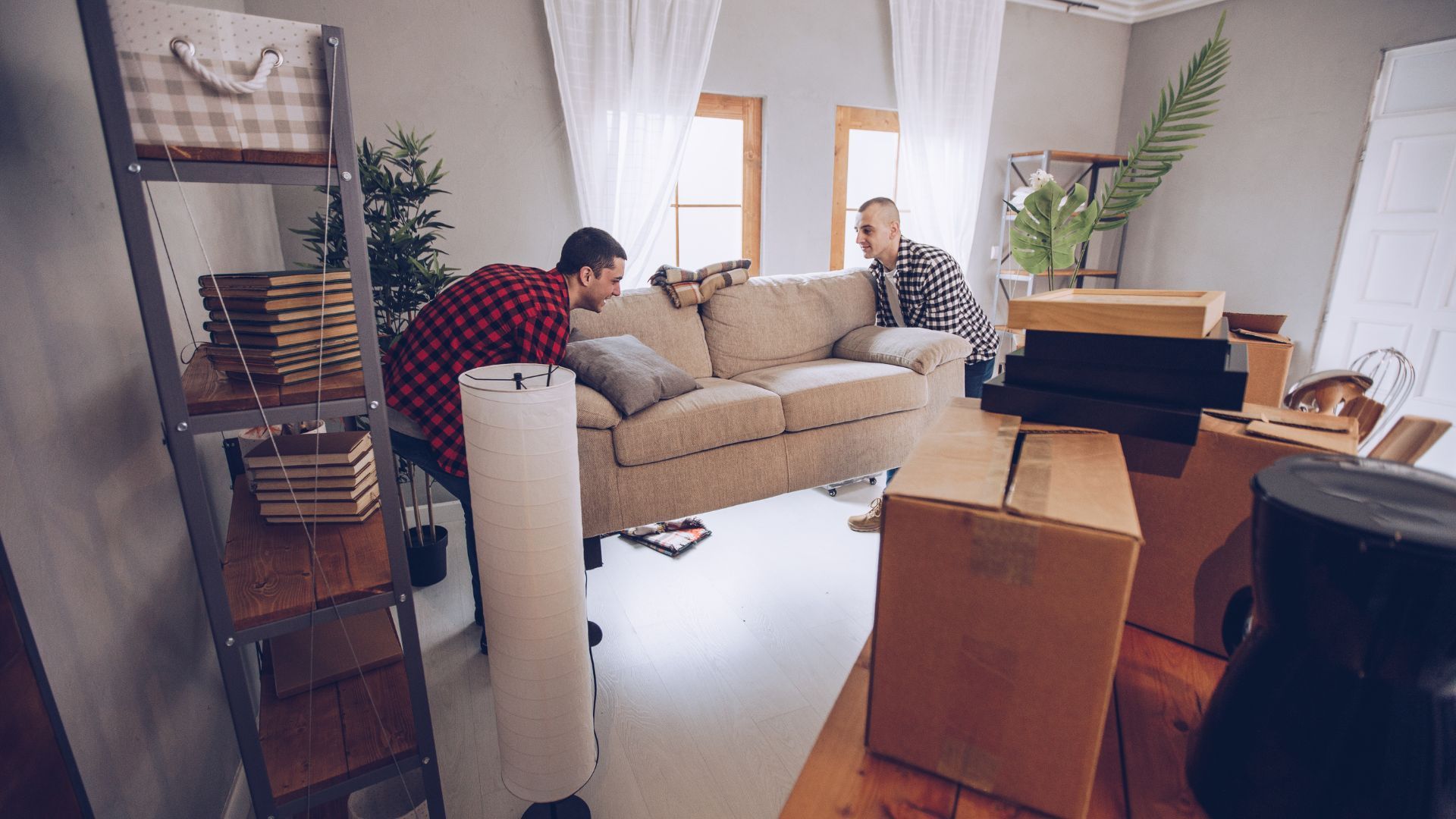 Movers Lifting a couch - Furniture delivery services