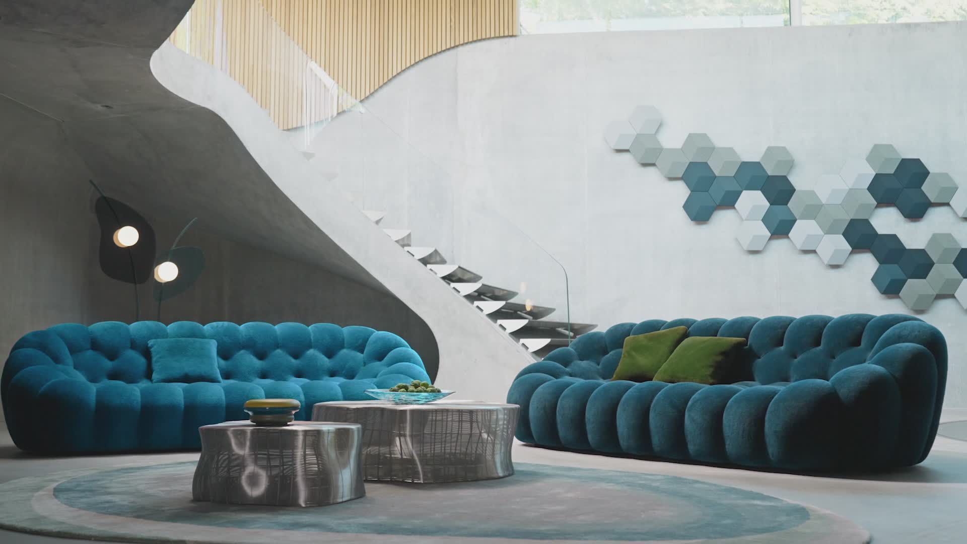 A living room with two blue couches and two coffee tables