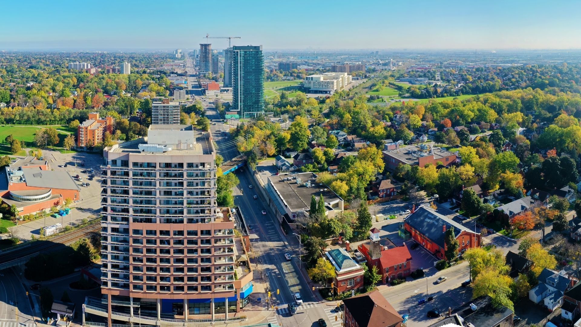 An aerial view of a city with lots of buildings and trees