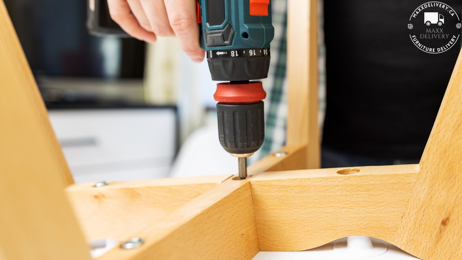 A person is using a drill on a piece of wood