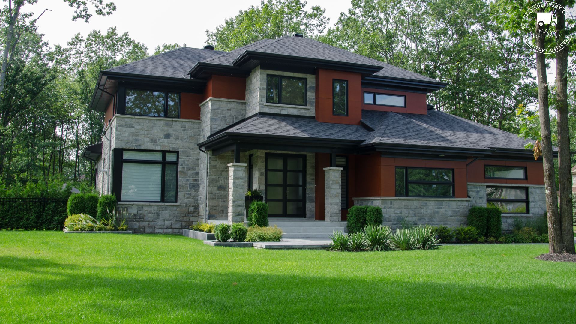 A large house with a lush green lawn in front of it