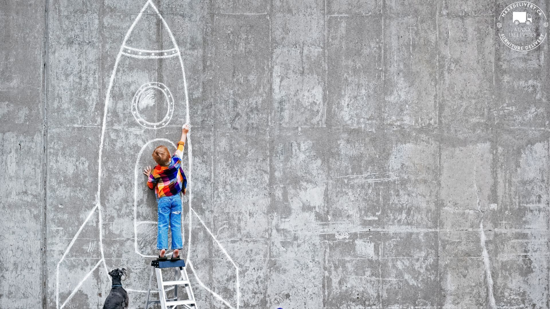 A child is standing on a ladder drawing a rocket on a wall.