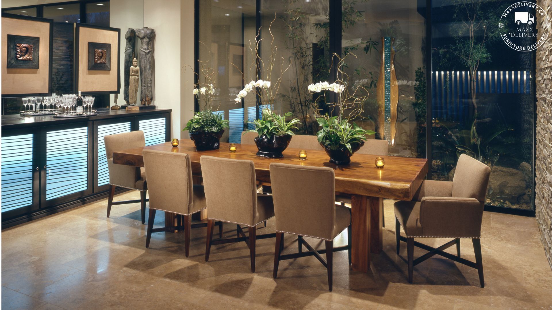 A dining room with a long table and chairs