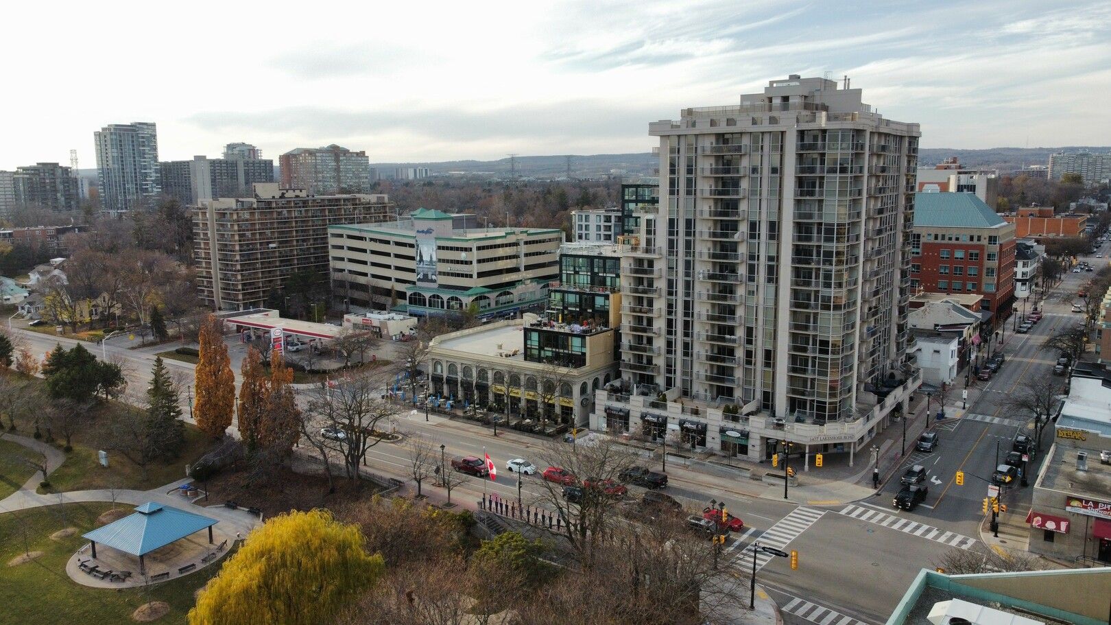 An aerial view of a city with a large building in the middle