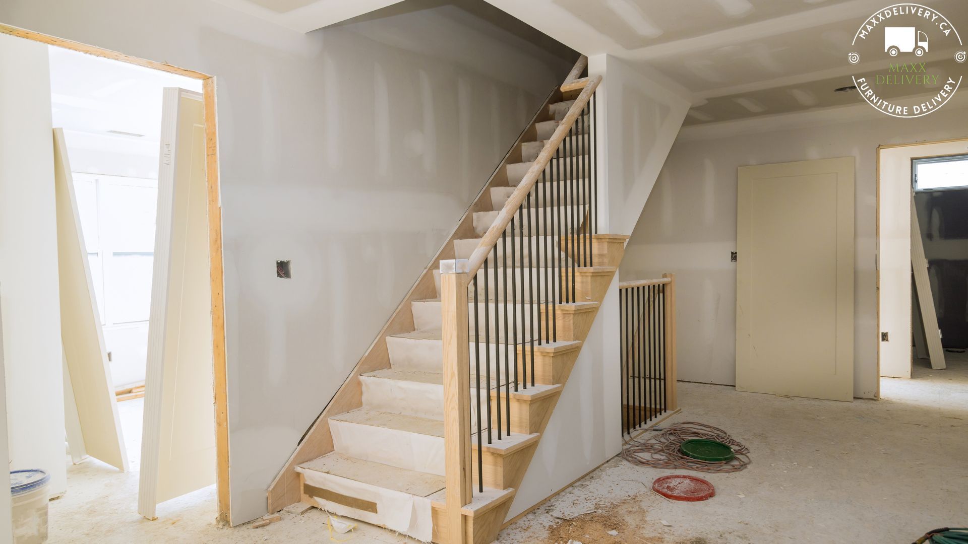 A wooden staircase in a house under construction