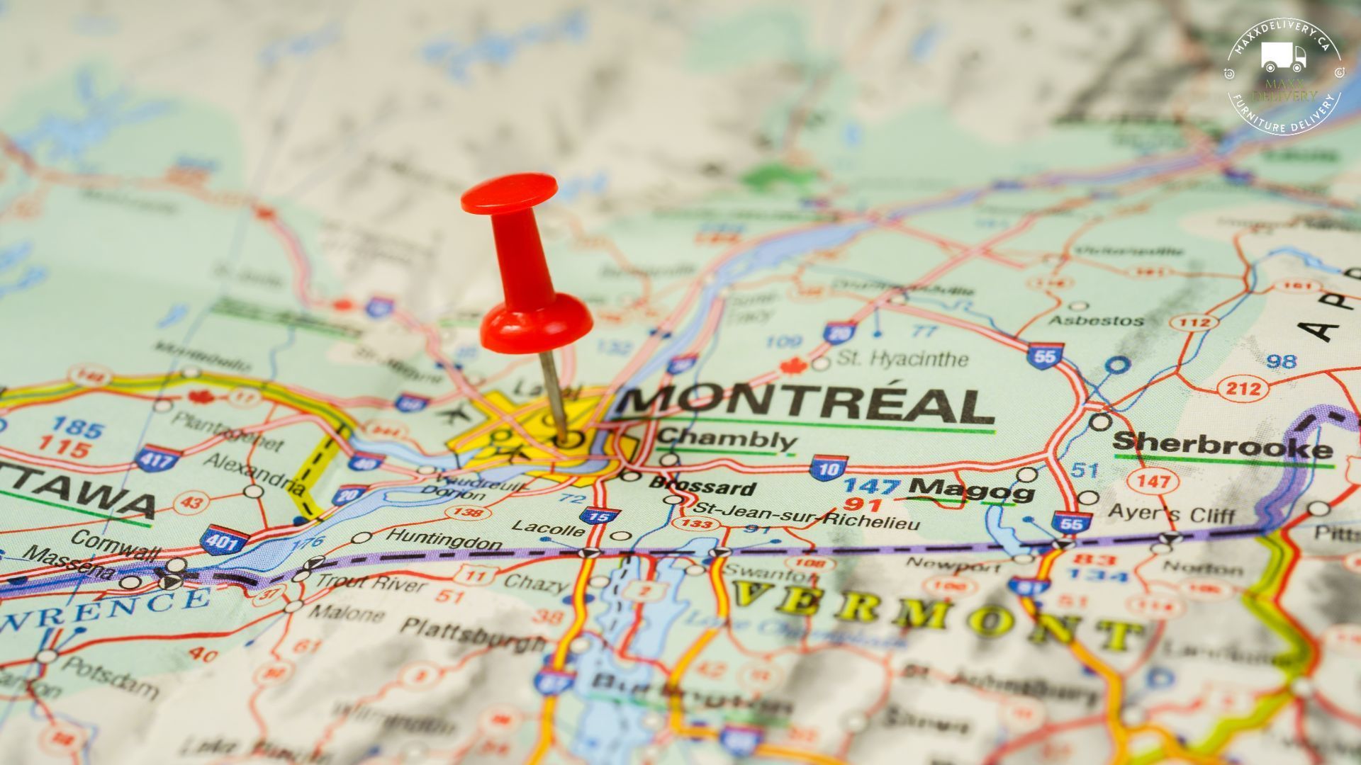 A red pin is pinned to a map of montreal - furniture shipping within canada