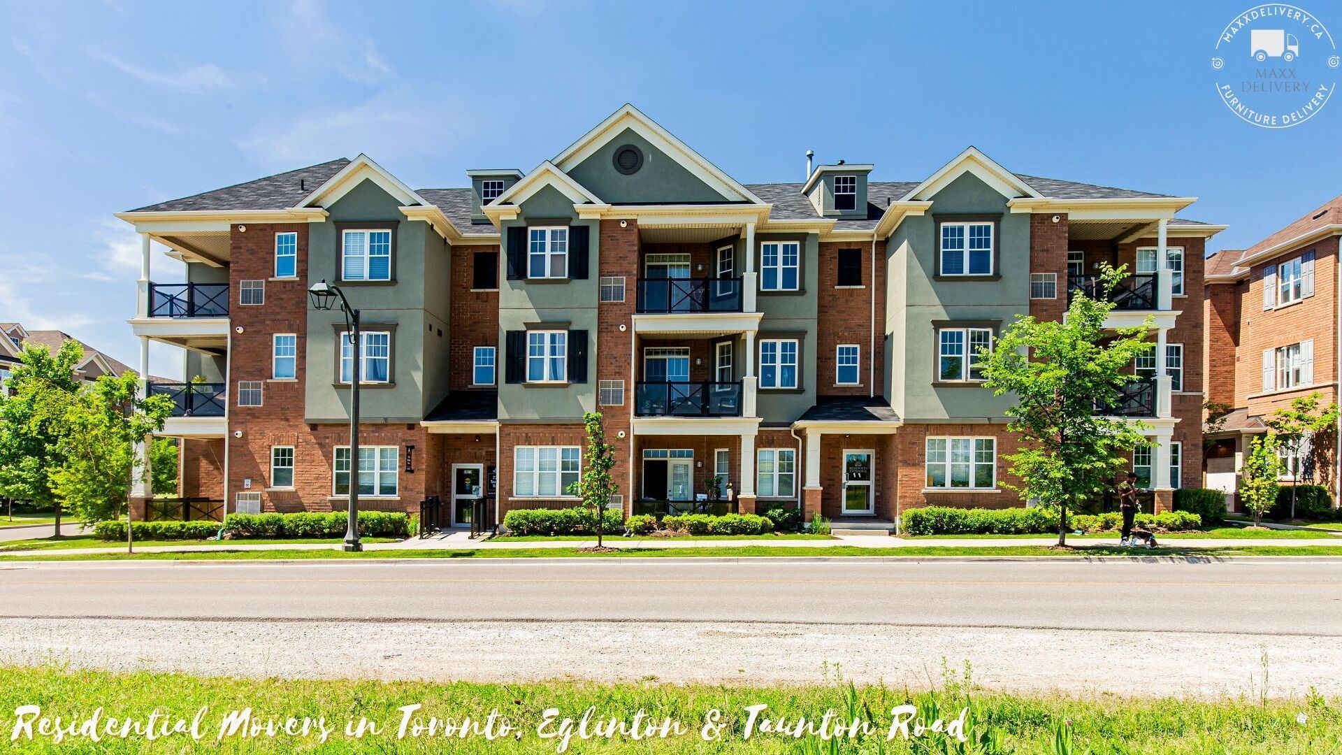 A large apartment building with a blue sky in the background