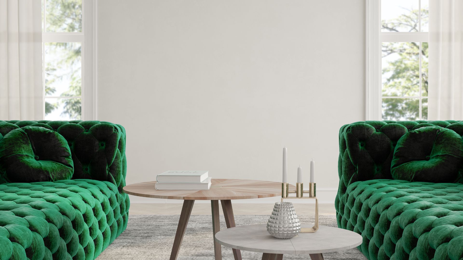 A living room with two green couches and a coffee table