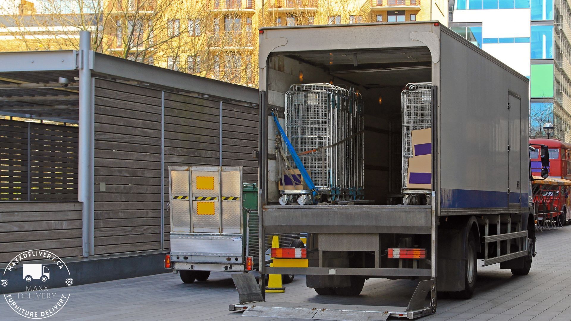 A gray truck is parked on the side of the road