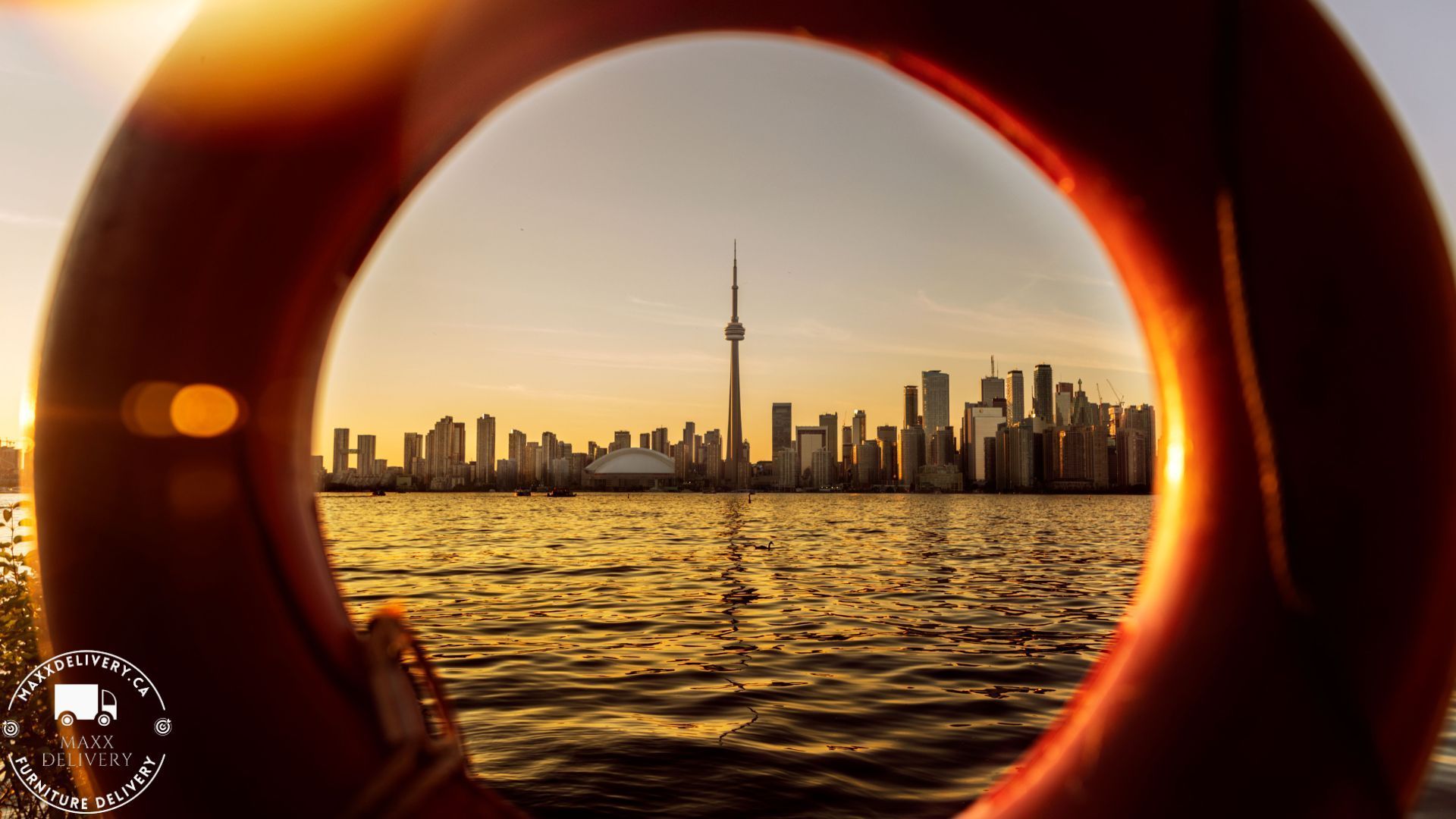 The skyline of toronto is seen through a life preserver