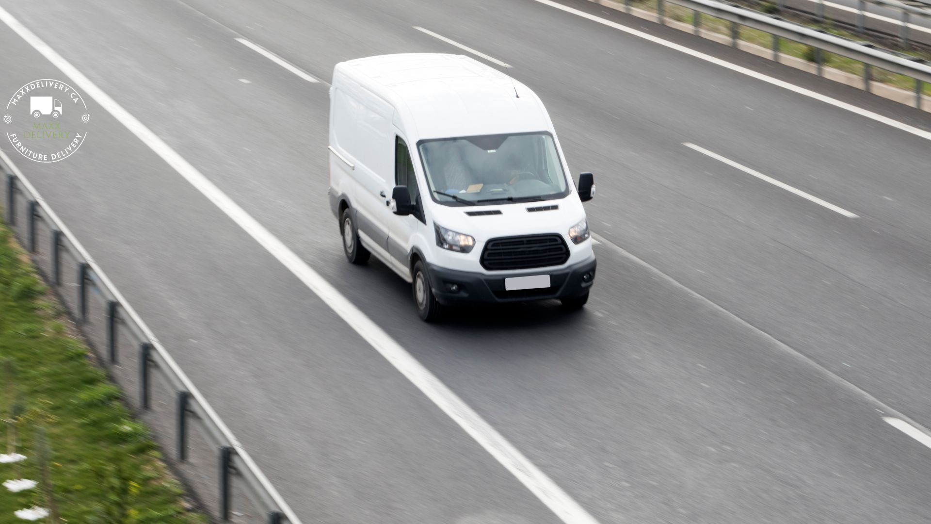 A white van is driving down a highway.