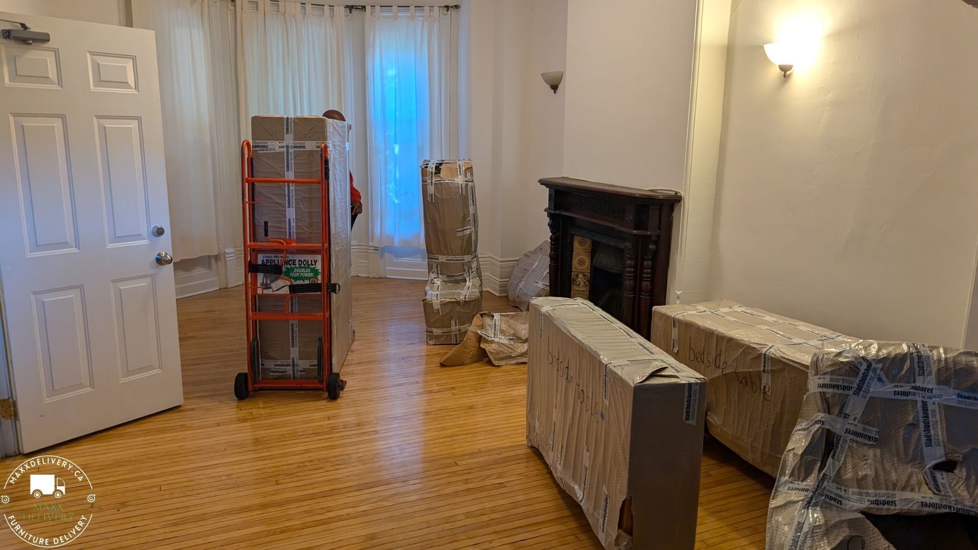 A living room filled with boxes and a fireplace