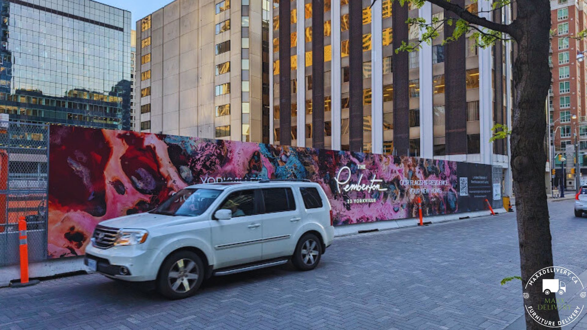 A white suv is parked on the side of the road