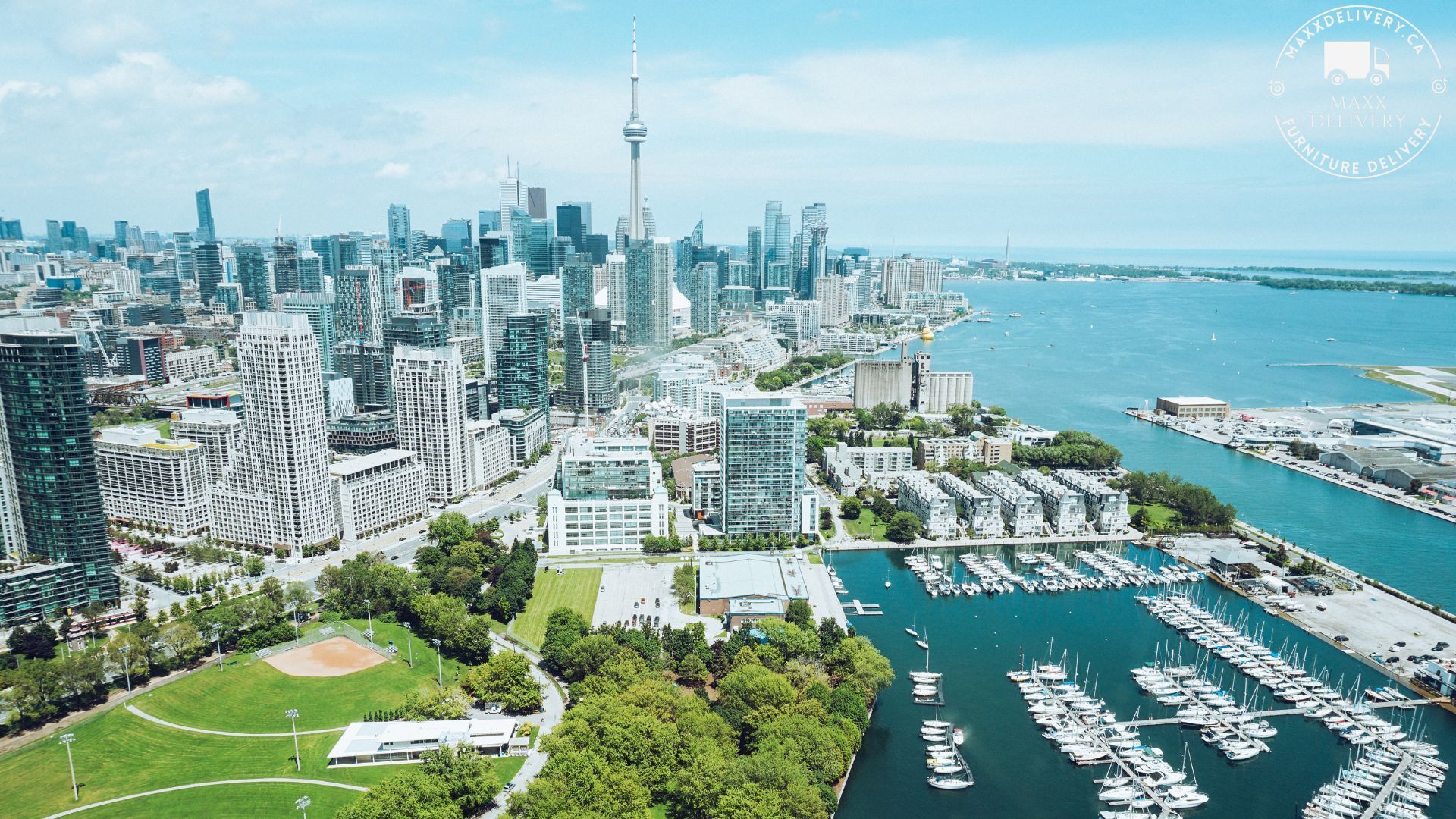 An aerial view of a city with a large body of water in the foreground