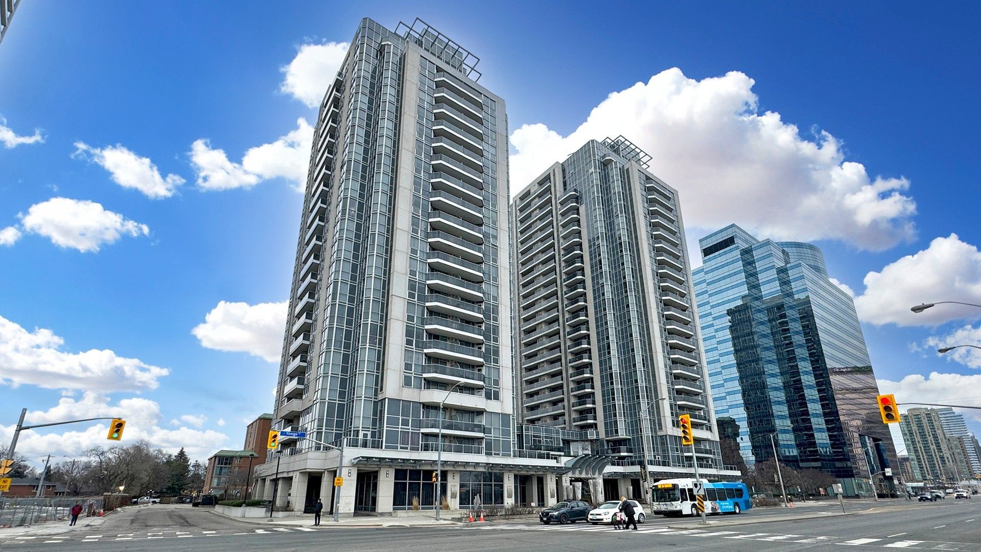 A city street with a lot of tall buildings