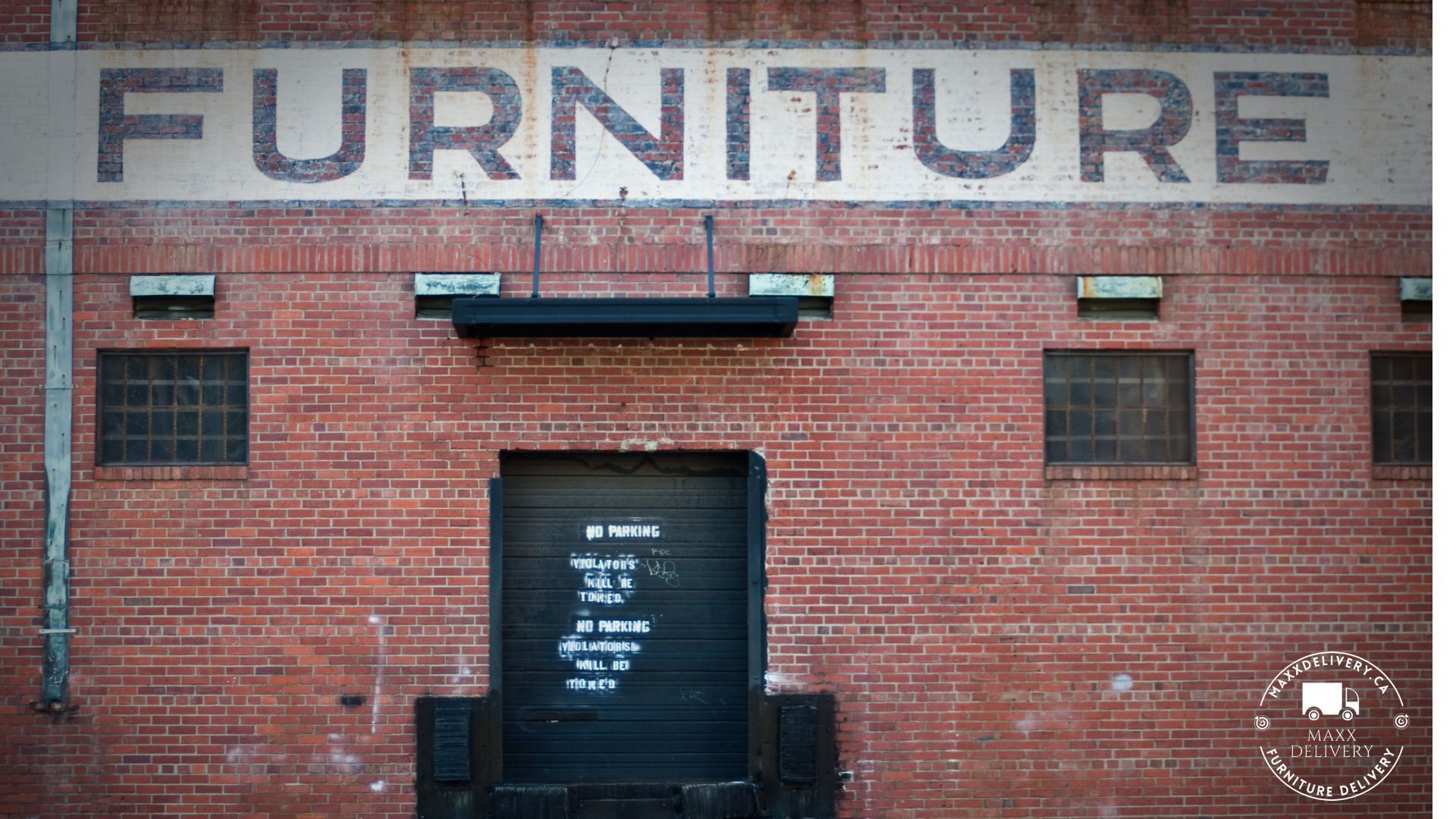 A brick building with the word furniture painted on it