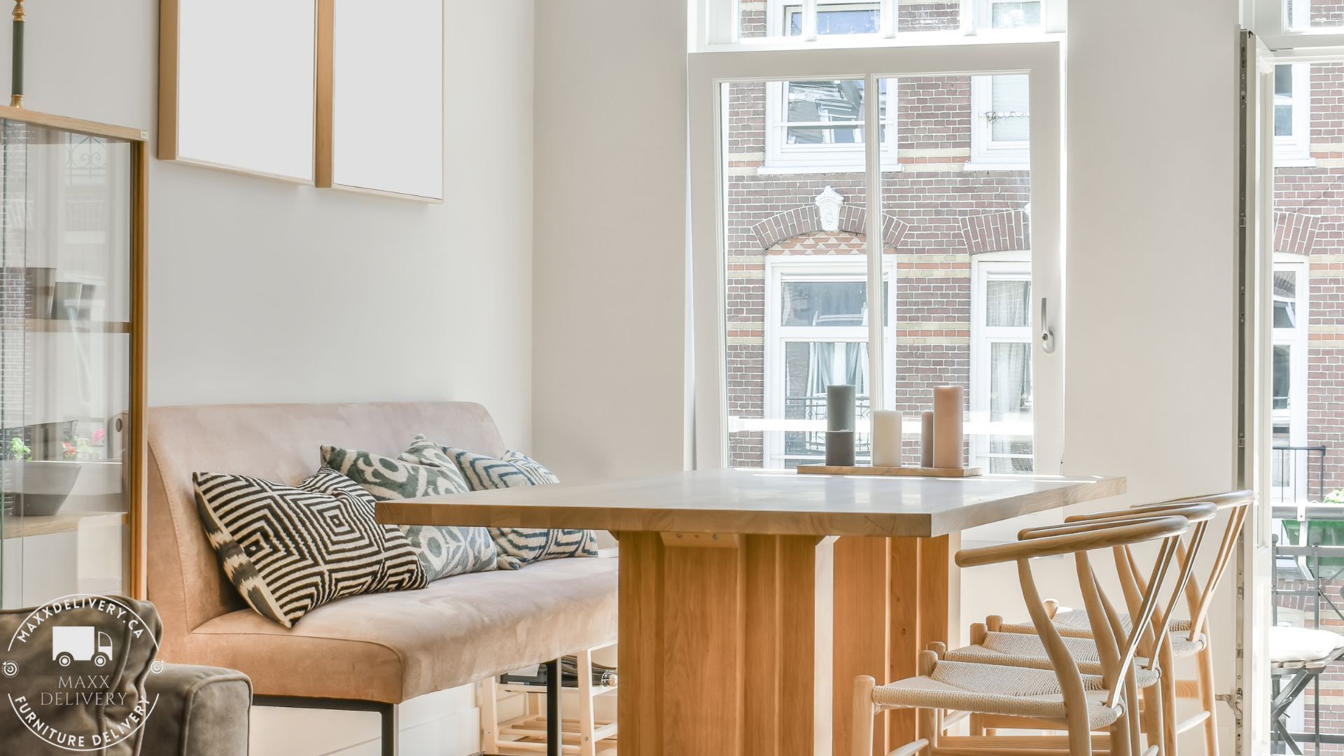 A living room with a table and chairs and a window