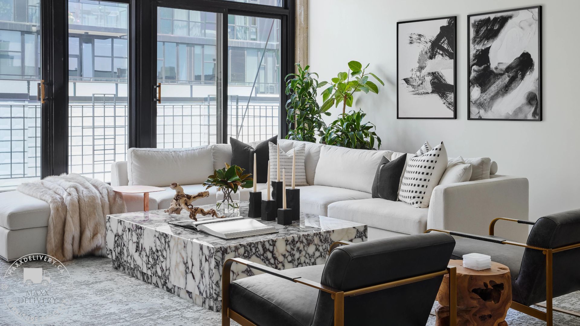 A living room with a couch , chairs , and a coffee table - how to hire movers