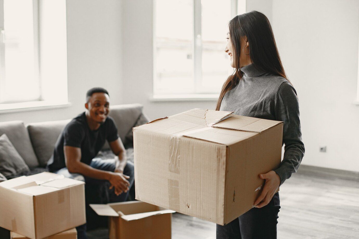 Interracial couple Afro-Asian moving to a new place. Delivery Made by MaxxDelivery.ca