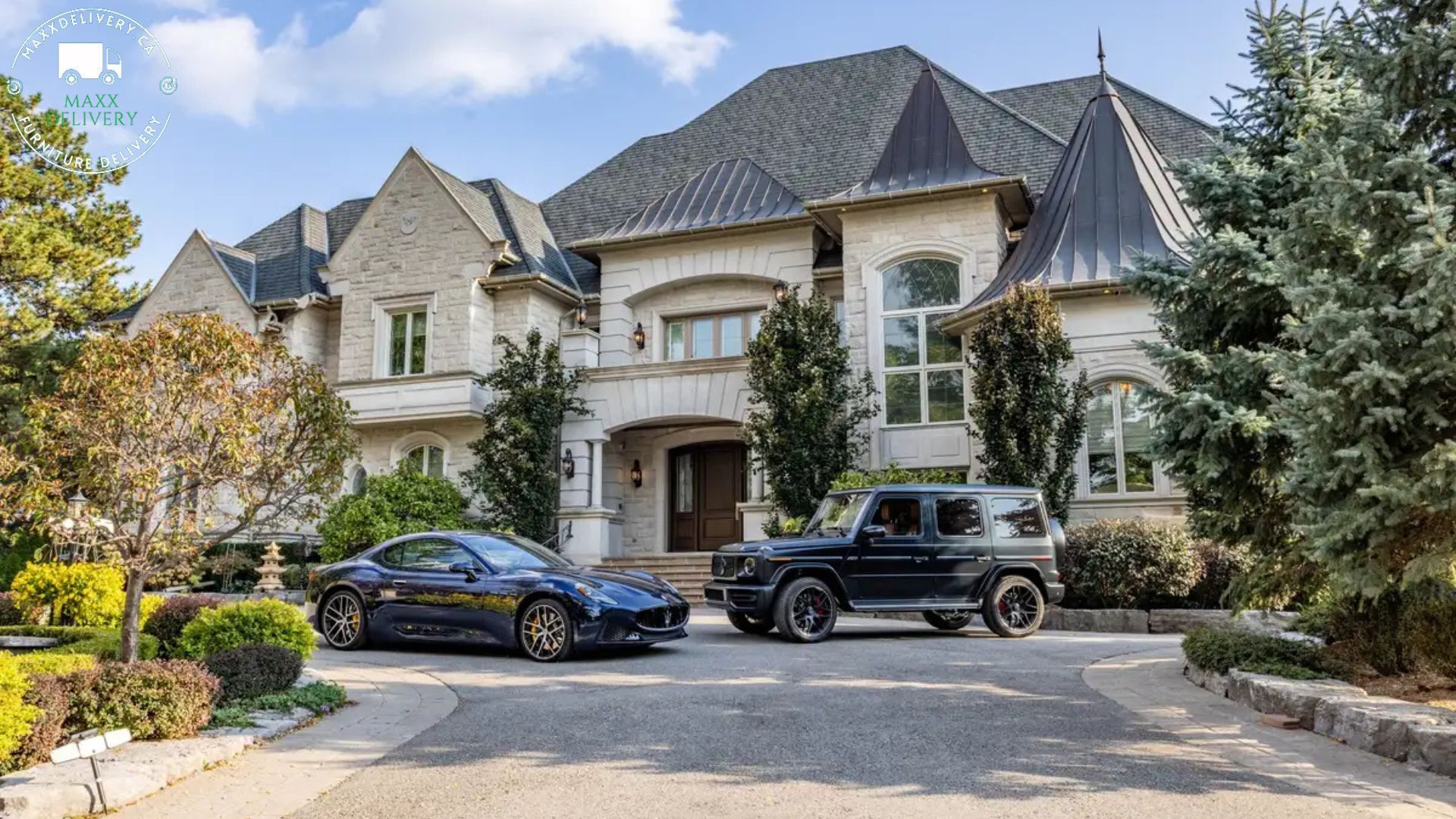 Two cars are parked in front of a large house.