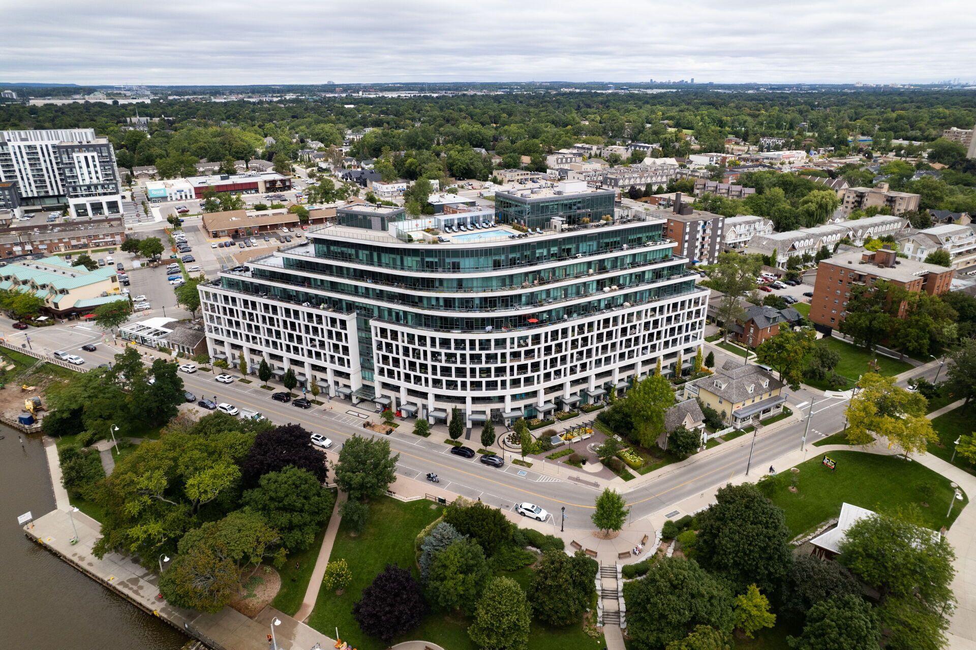 An aerial view of a city with a large building in the middle