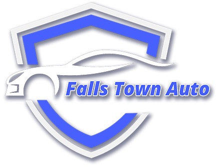 Logo for Falls Town Auto: a blue and white shield shape with a stylized car silhouette.