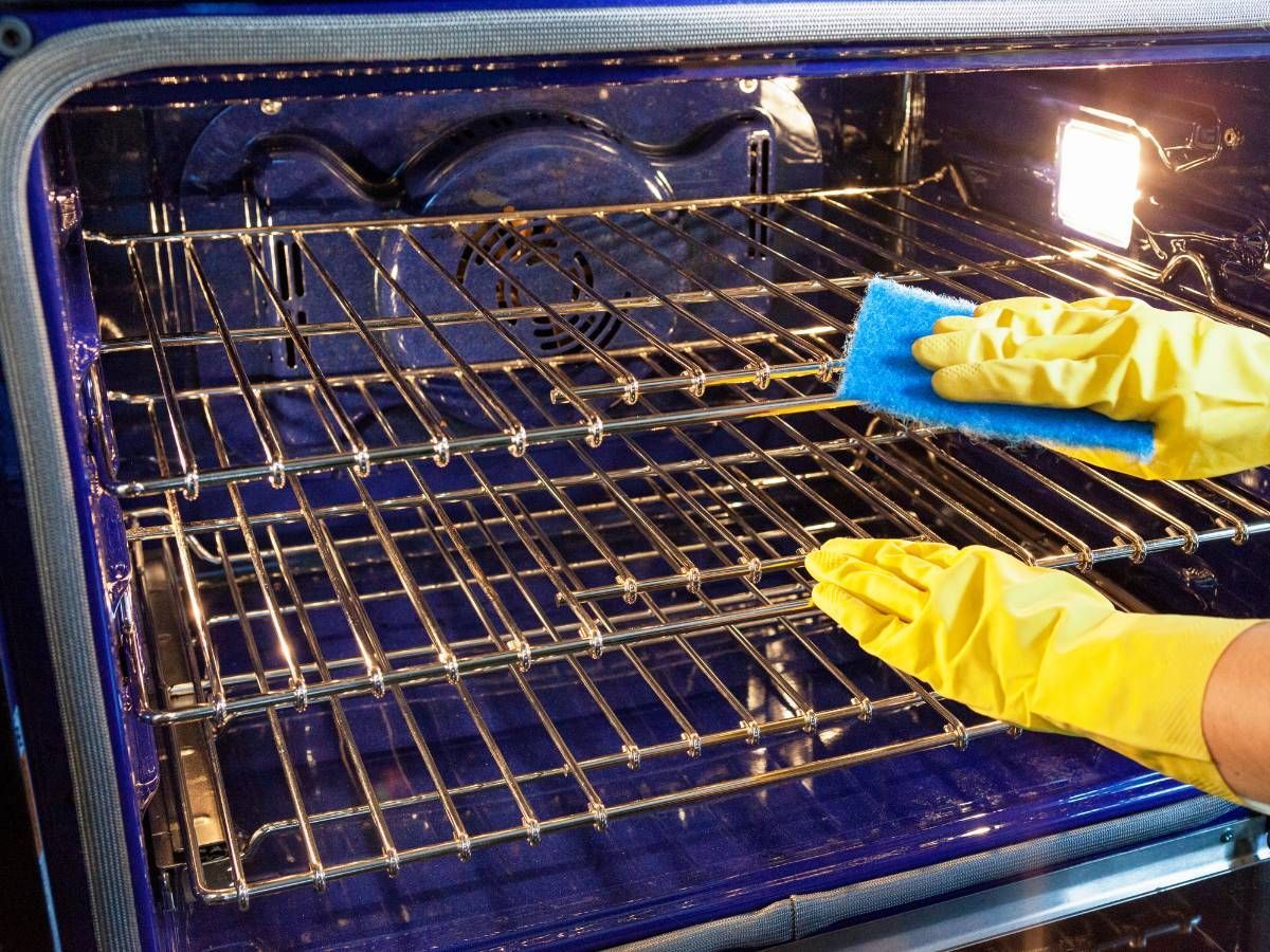 Squeaky Cleaners Nottingham cleaning an oven as part of an airbnb clean