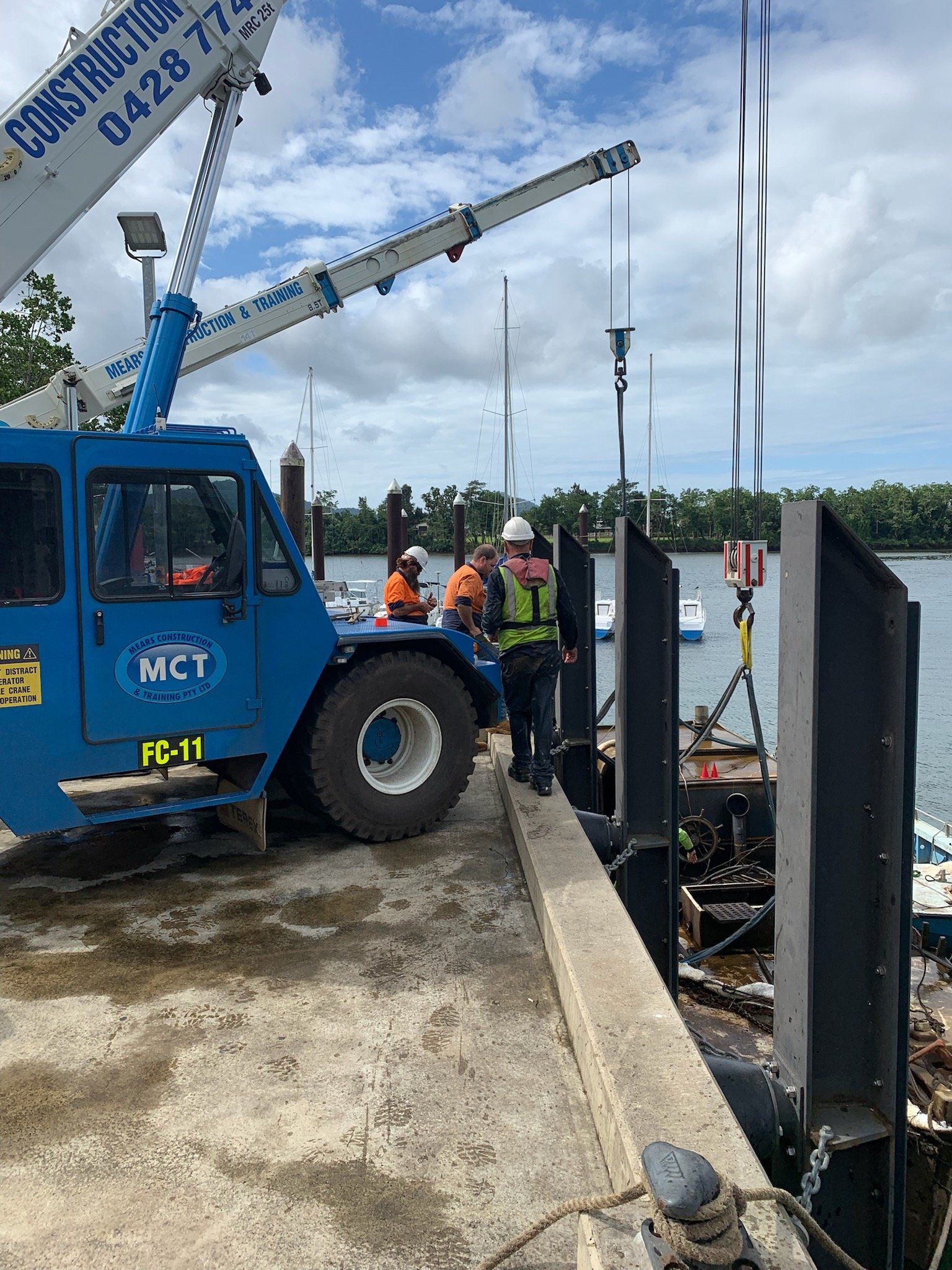 Crane Lifting Boat From Water — Equipment Hire in South Johnson, QLD