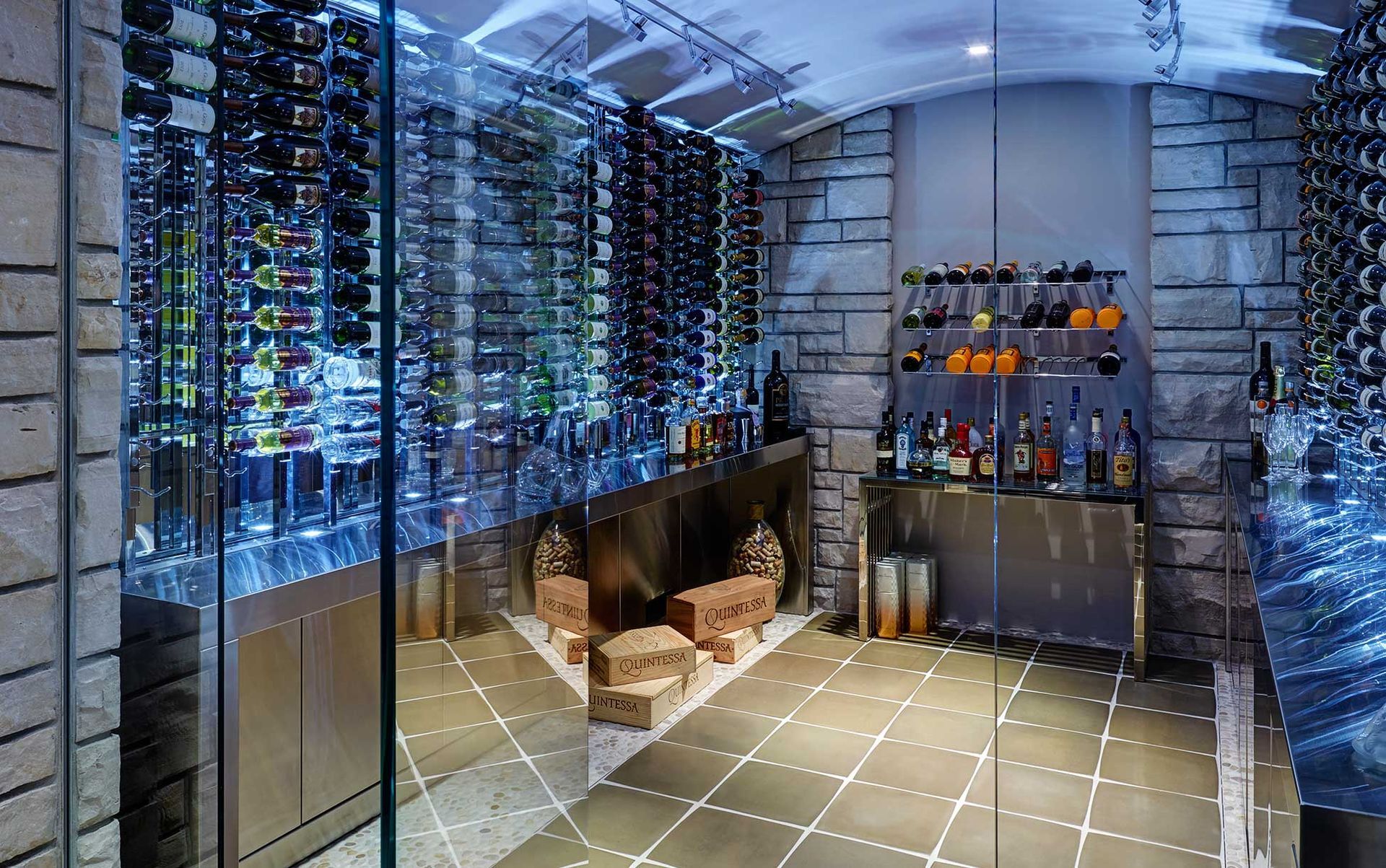 A wine cellar filled with lots of wine bottles and a bar.
