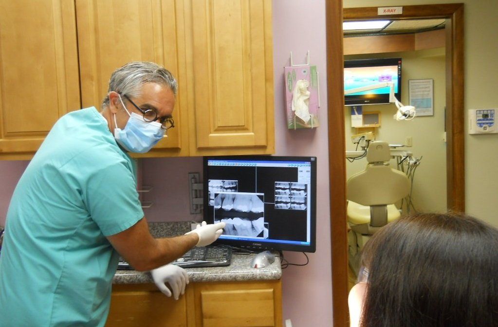 Dentist showing x-rays
