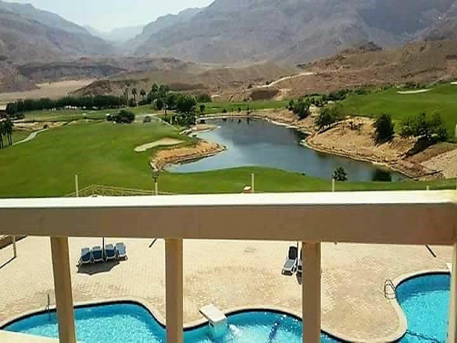 real estate view of golf course from balcony