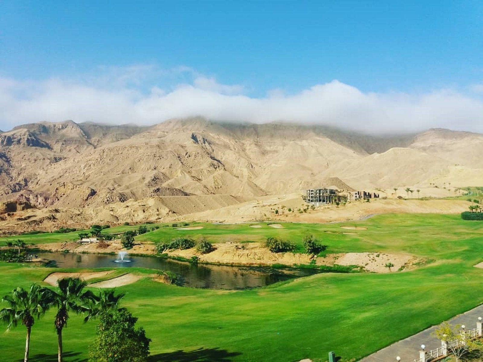 golf course with mountains