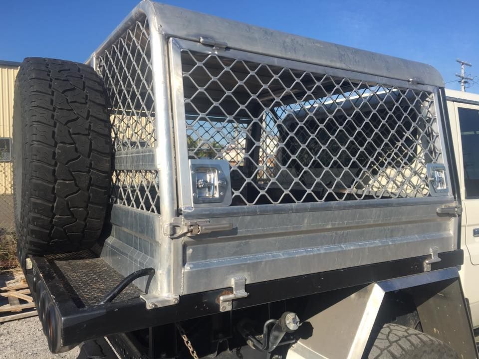 A Truck with A Tire on The Back of It and A Cage on Top of It — K & S Sheetmetal in Gladstone Central, QLD