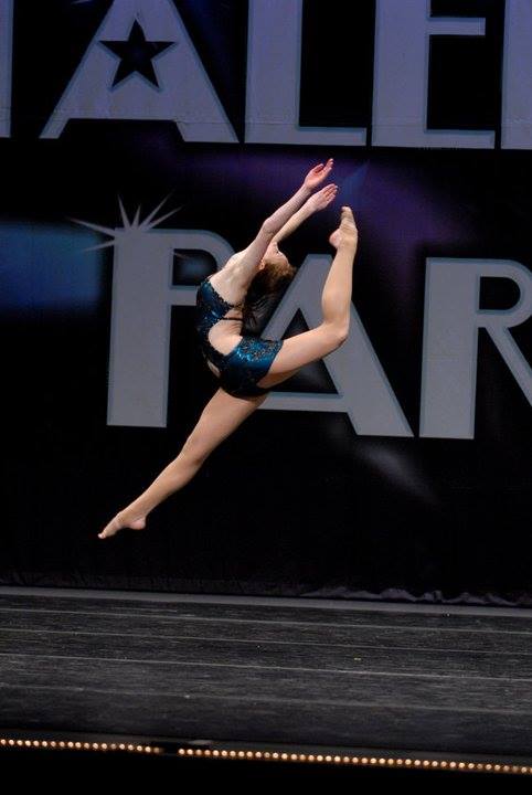 A ballet dancer performing in a dance competition