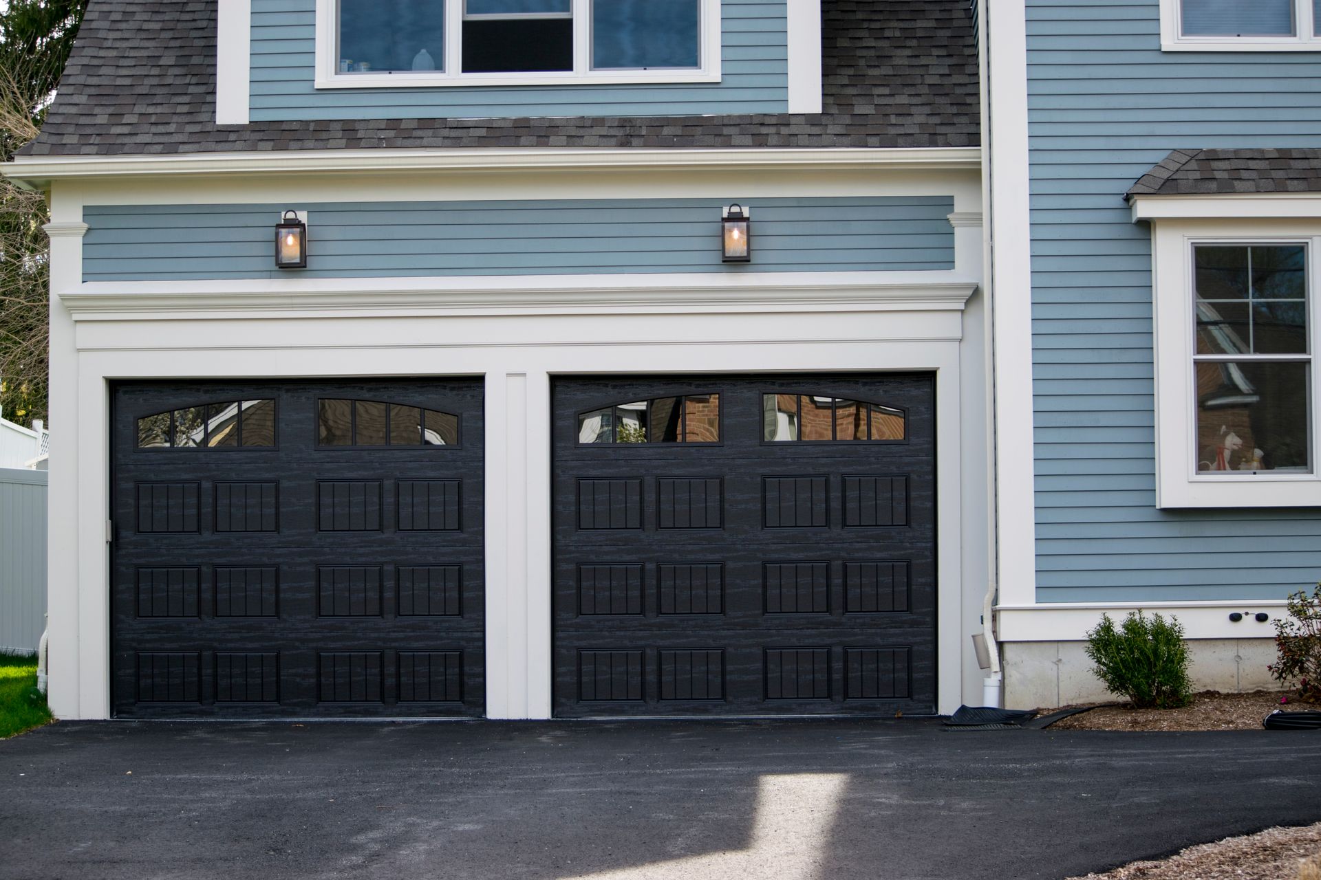 Two black garage doors