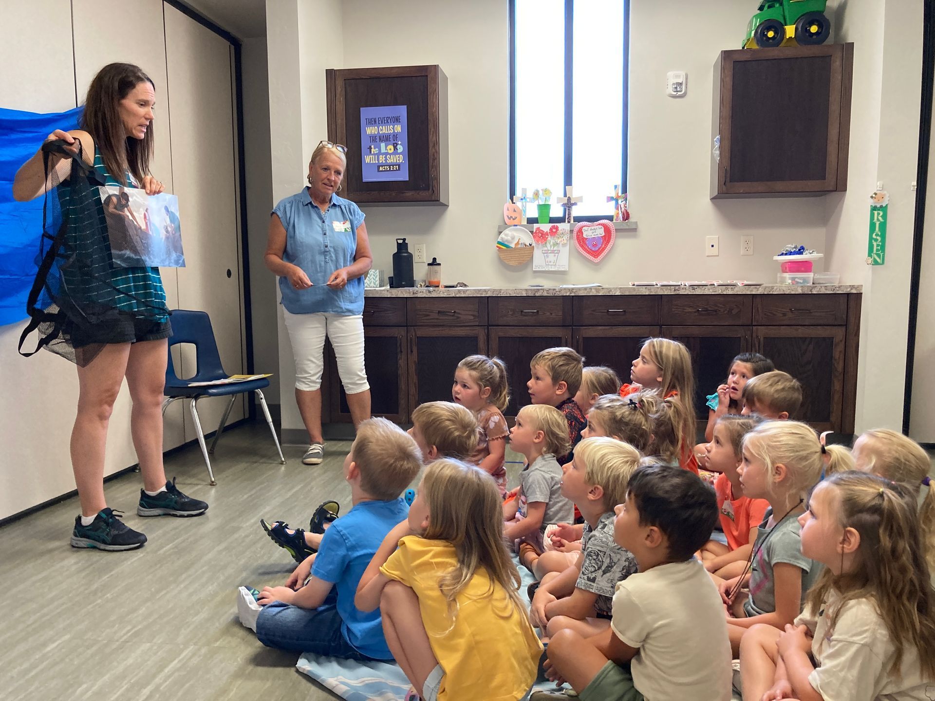 Two woman laughing with microphones