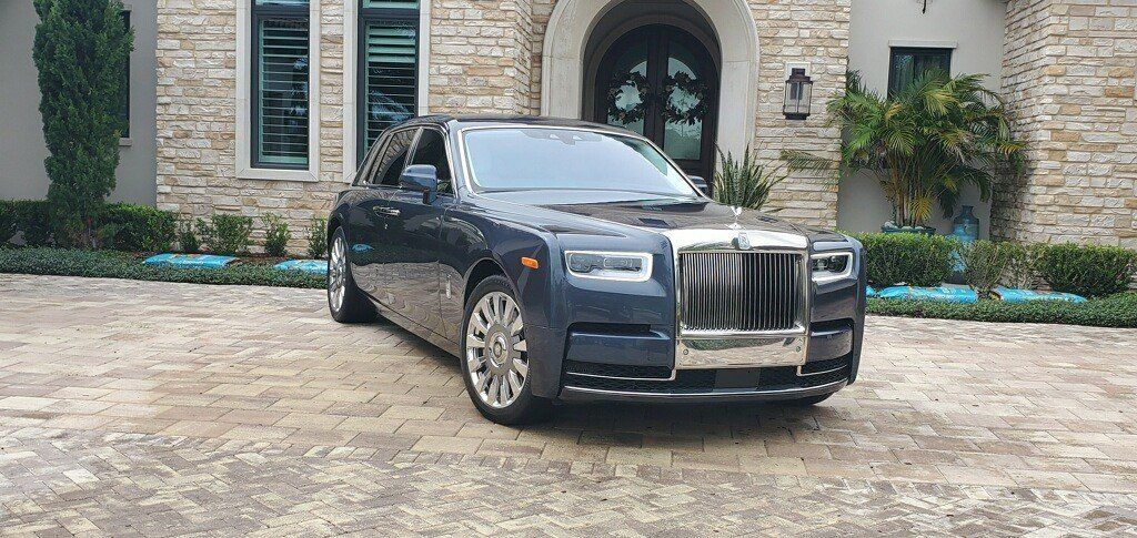 Car Parked On Front Of Modern House — Melbourne, Florida — A Absolute Mobile Auto Detailing