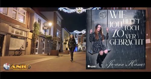 Street scene with singer and album cover: woman walks in street, album cover reads