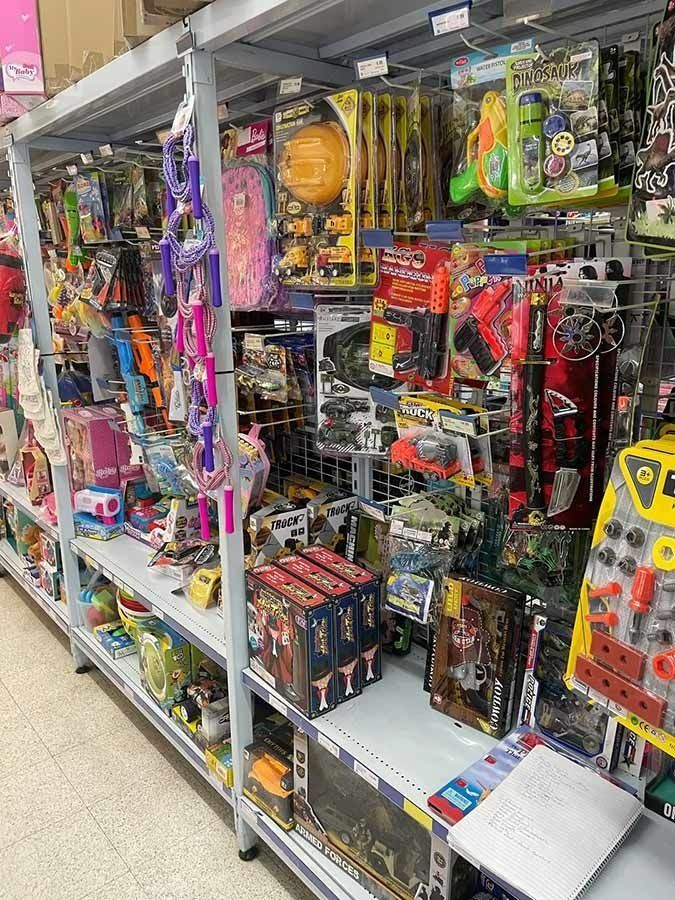 Shelves Stocked With Toys in a Store. Packages of Toys — Pigglys Supermarket, Takeaway & Bottle Shop in The Gap, NT