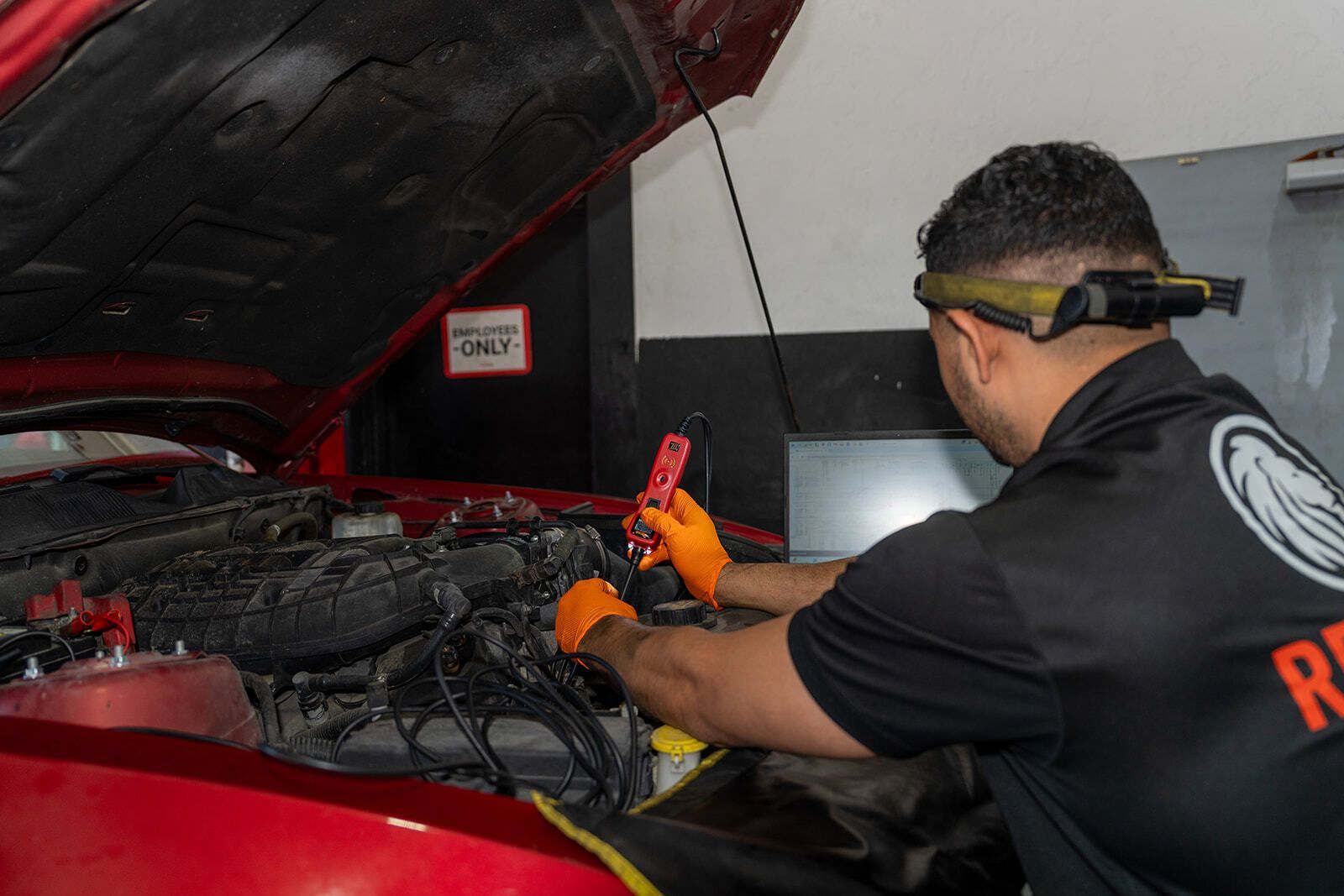 Technician Performing Vehicle Maintenance | Auto Vice