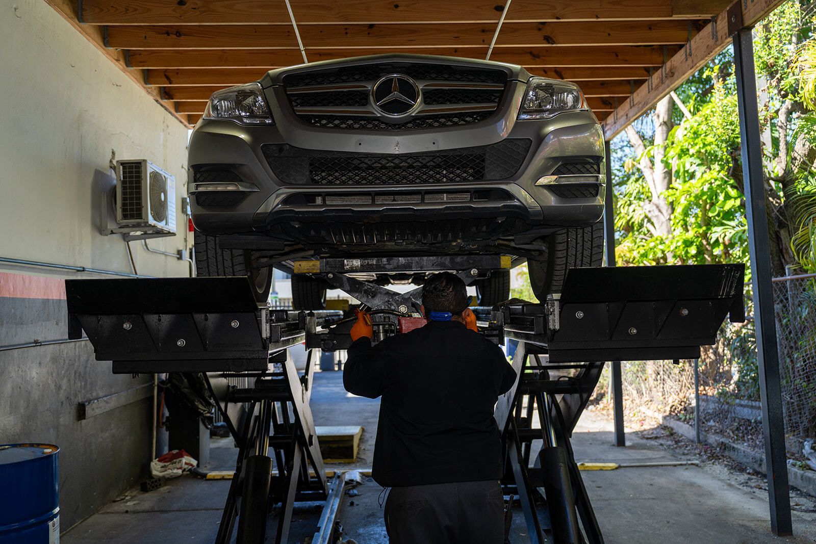 Mercedes-Benz Vehicle Being Serviced on an Automotive Lift | Auto Vice
